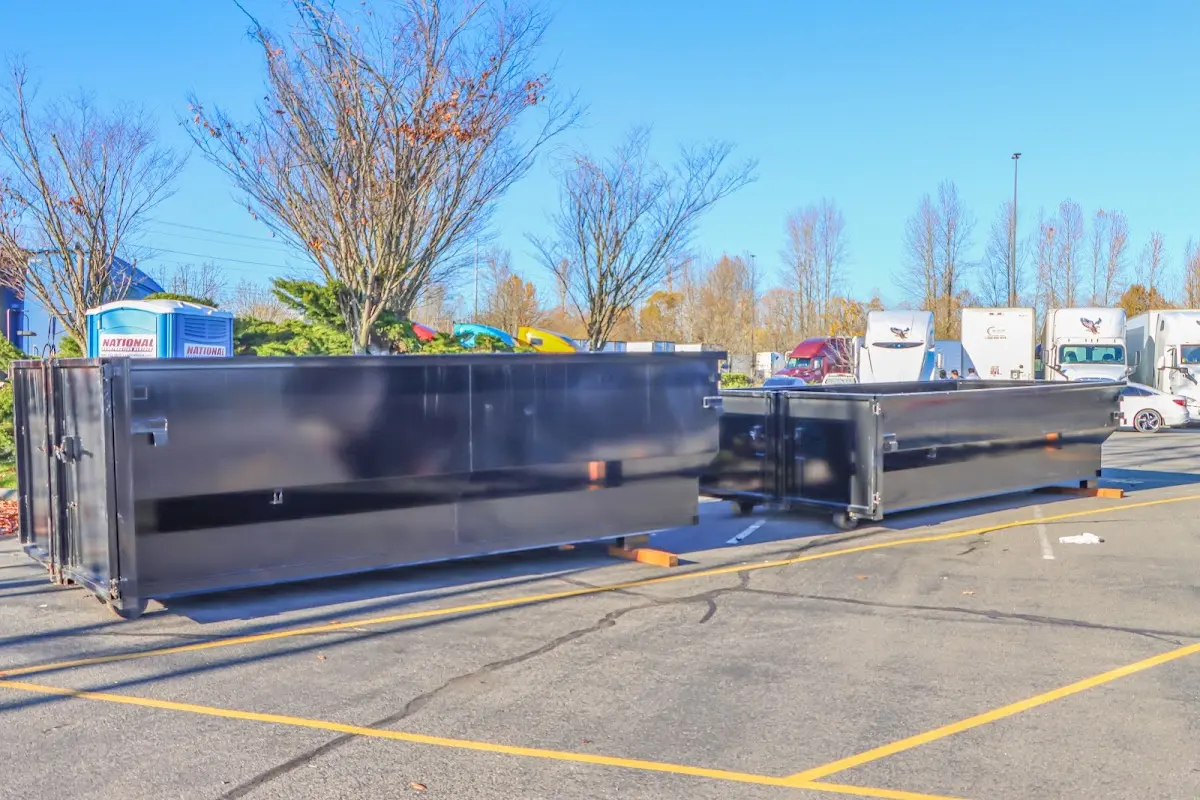 Professional dumpster rental service with roll-off container on residential driveway in Doctor Phillips